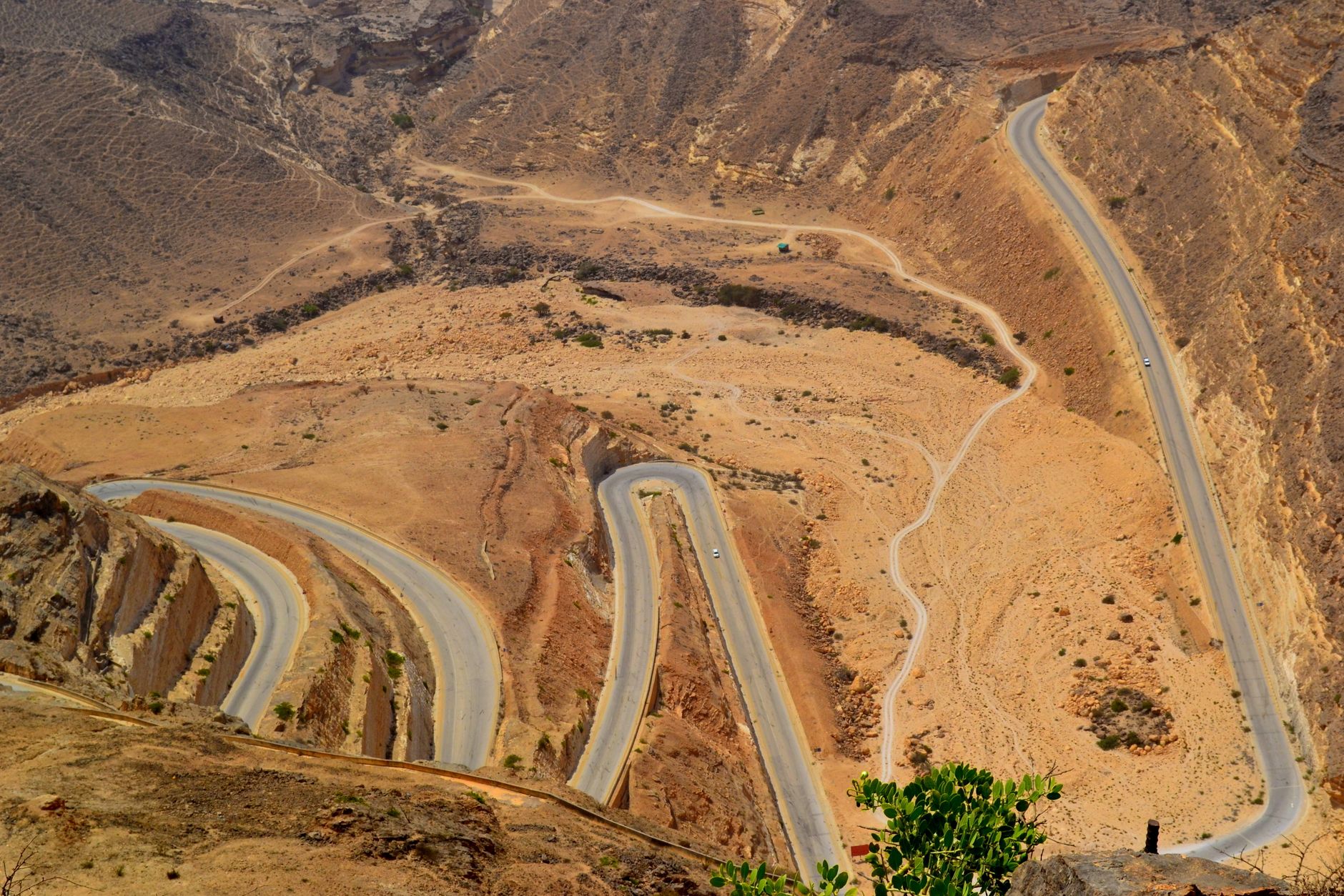 A highway threading through the Oman landscape from the air