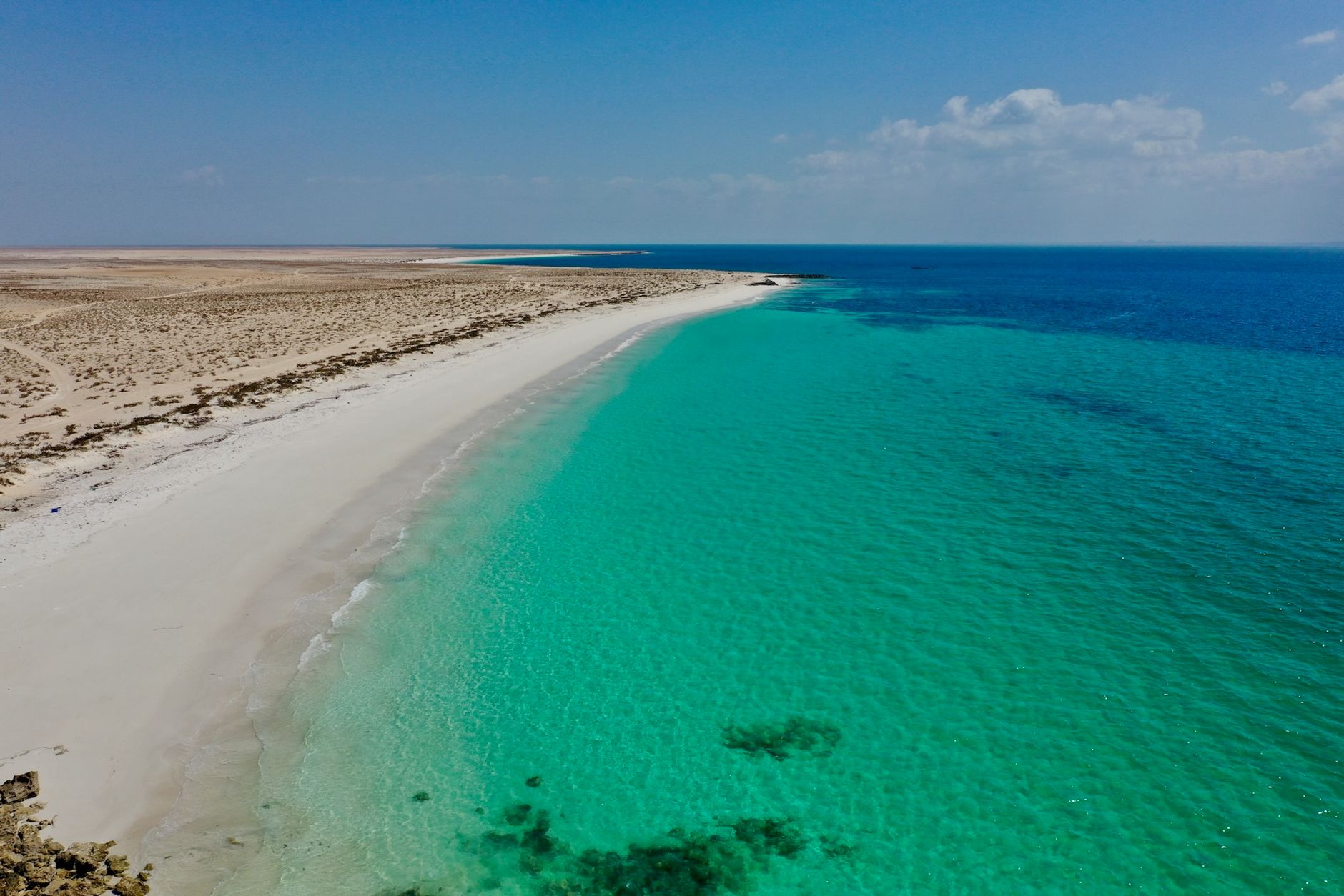 A quiet white-sand beach on the Dhofar coast near Salalah